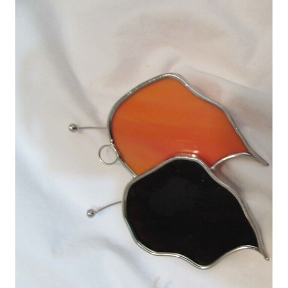 Stained glass leaves and lion handmade ornaments hang in window - Picture 5 of 7